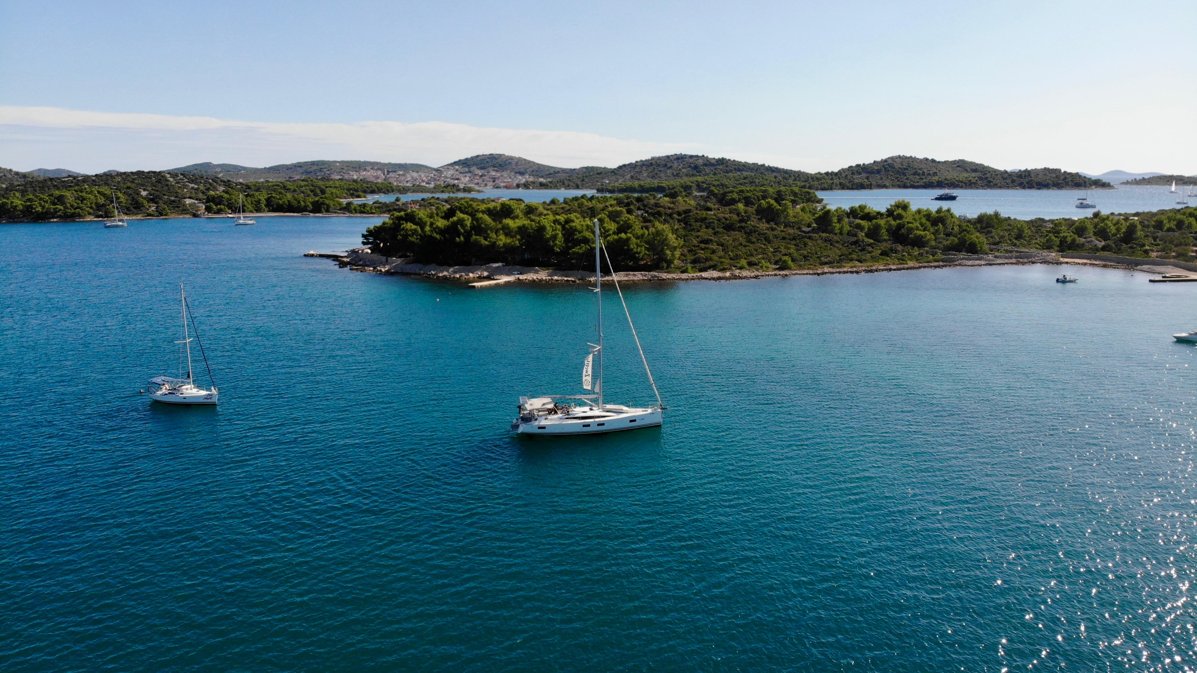 Two KEK yachts anchored in a clear Adriatic bay